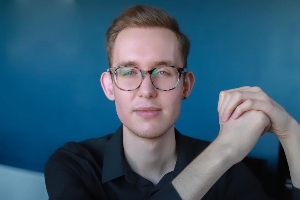 Students sitting around a table in a green living workshop